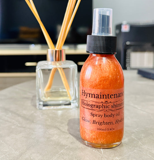 Hymaintenance holographic shimmer spray body oil